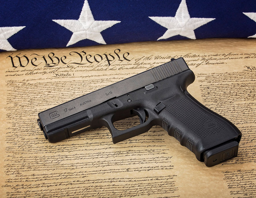 Pistol laying on the constitution image