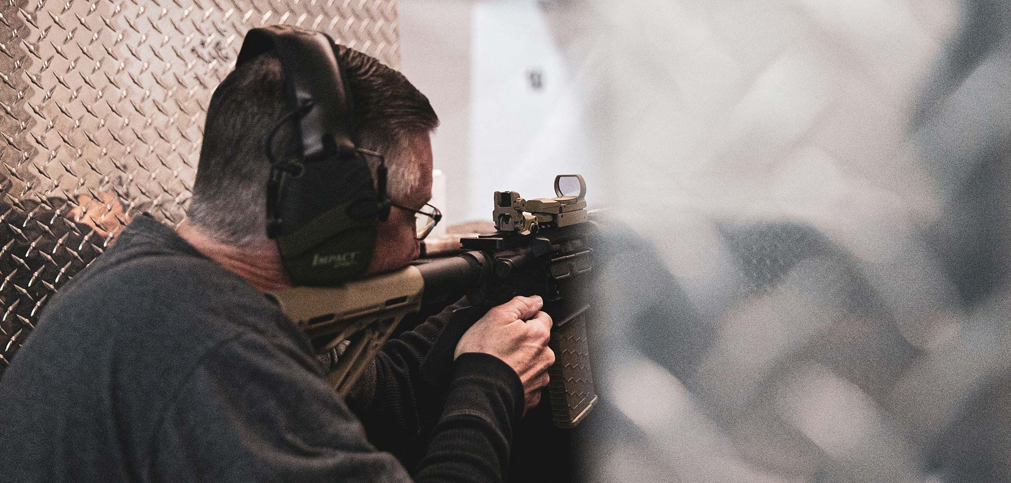 Man shooting rifle image